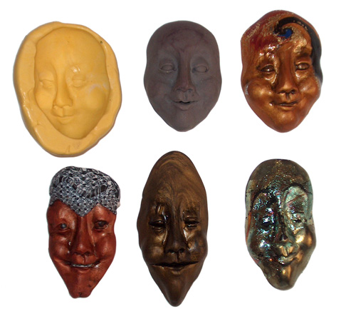 a silicone mold with the original polymer clay face and other faces made from the mold